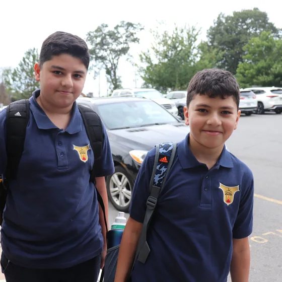 Two pupils outside school