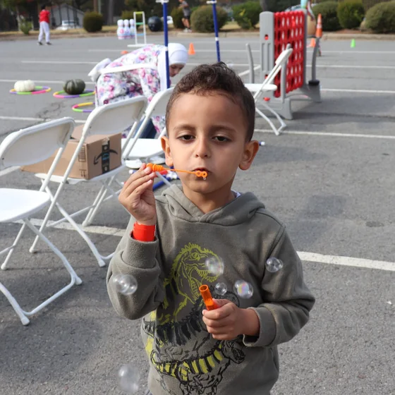 A pupil with a treat at the Fall Fest